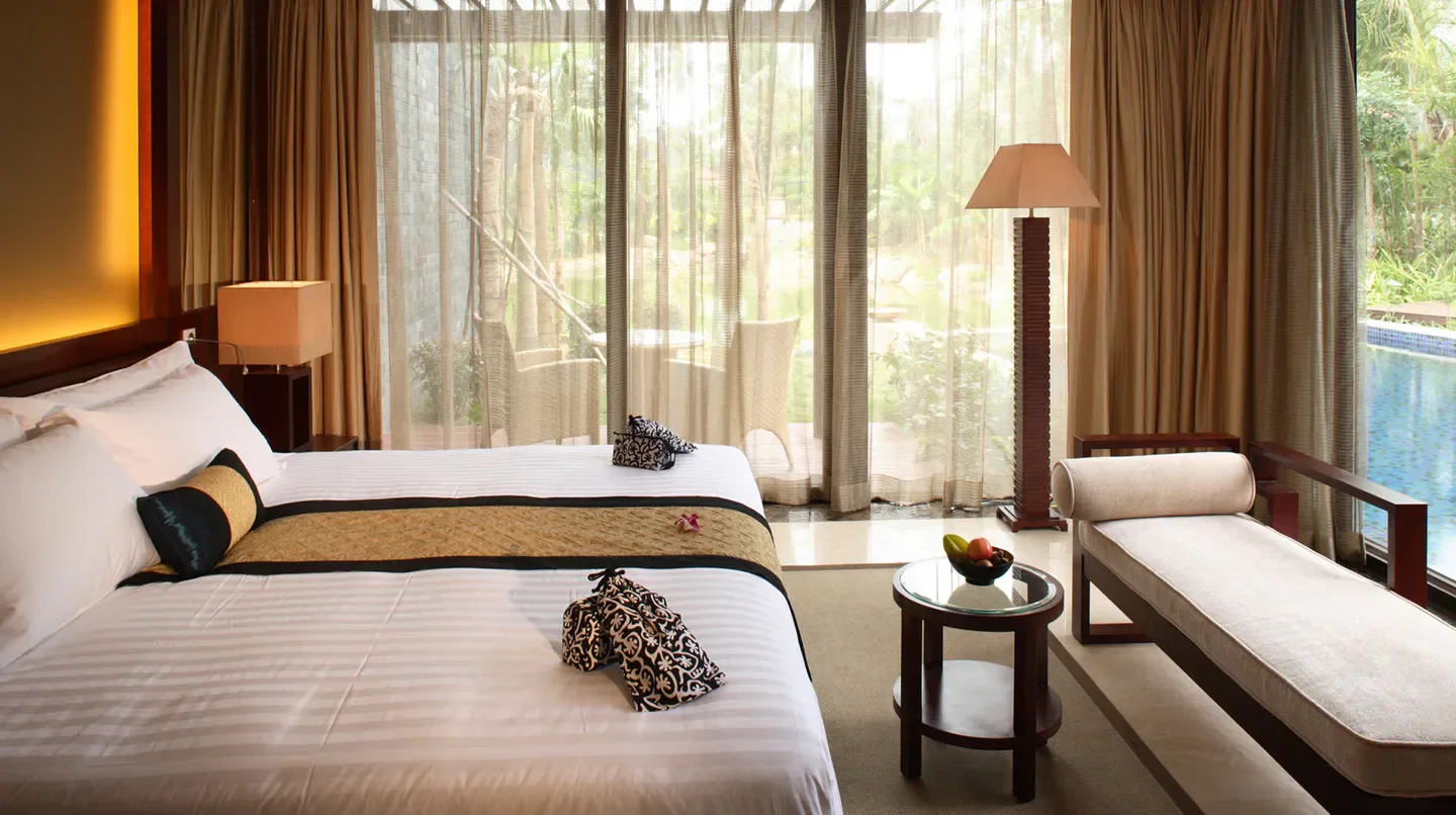 Luxury bedroom at Banyan Tree Sanya, overlooking a pool in beautiful Sanya, China.