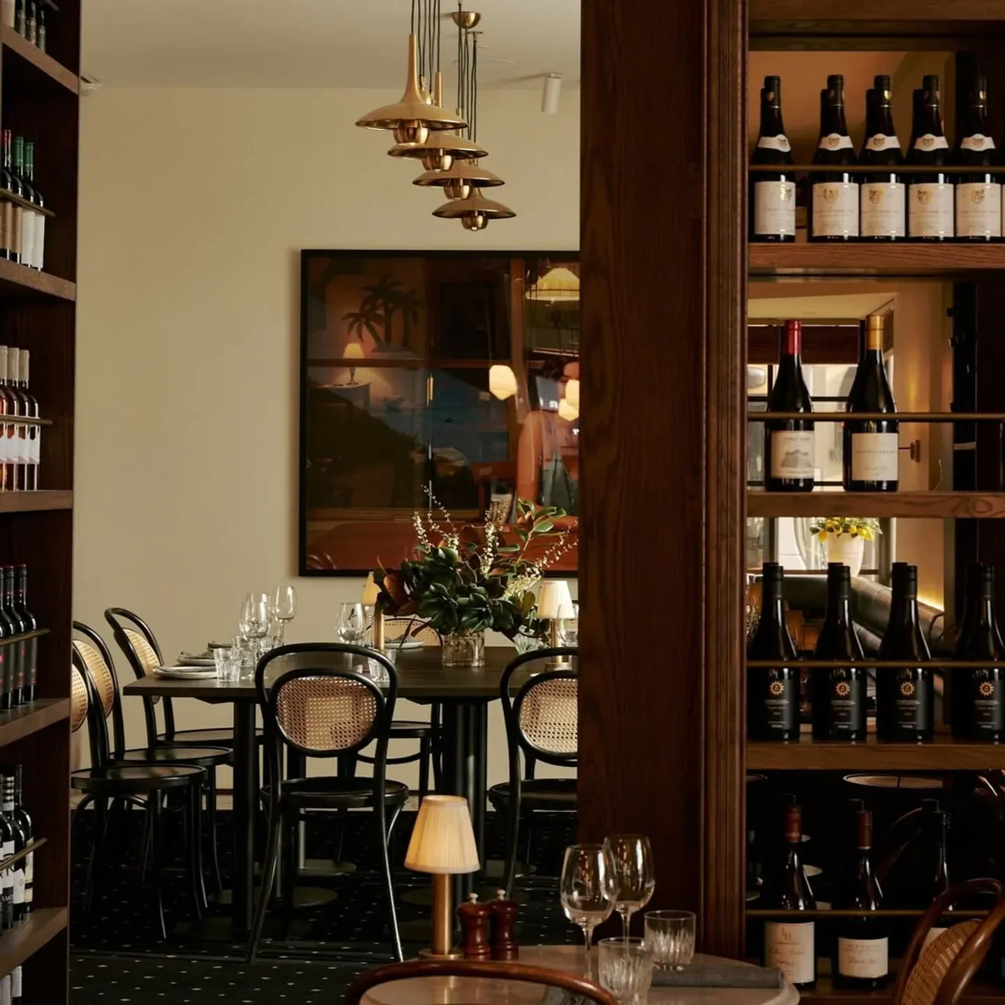Elegant dining scene at Bar Bianco in Melbourne, featuring wine and stylish interior.