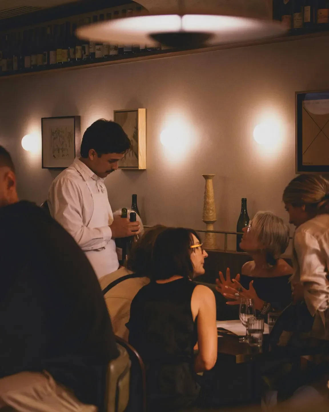 Atmospheric dining at Bar Heather in Byron Bay. Guests enjoy drinks and conversation.