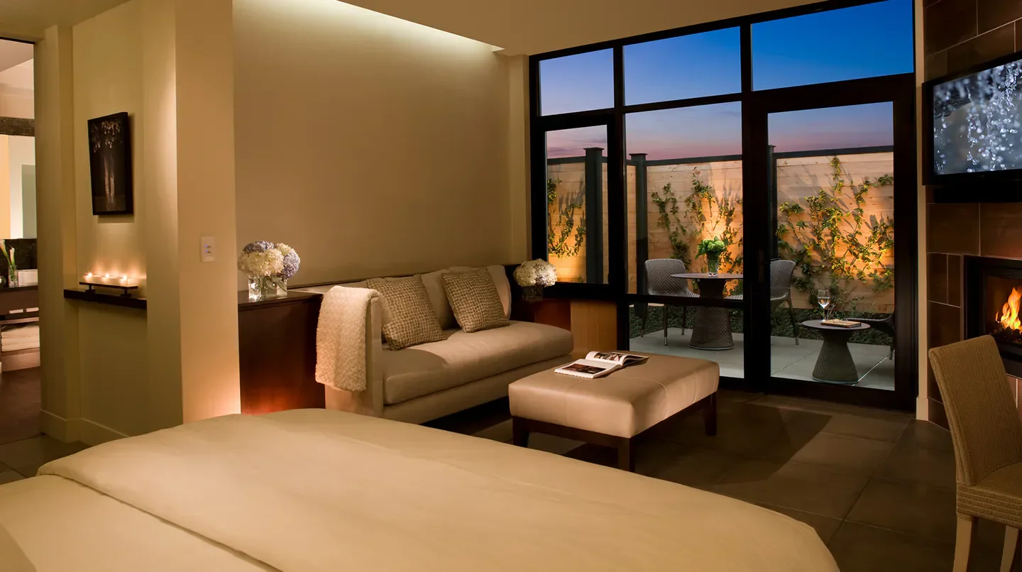 Cozy room at Bardessono Hotel and Spa in Napa Valley with patio and fireplace