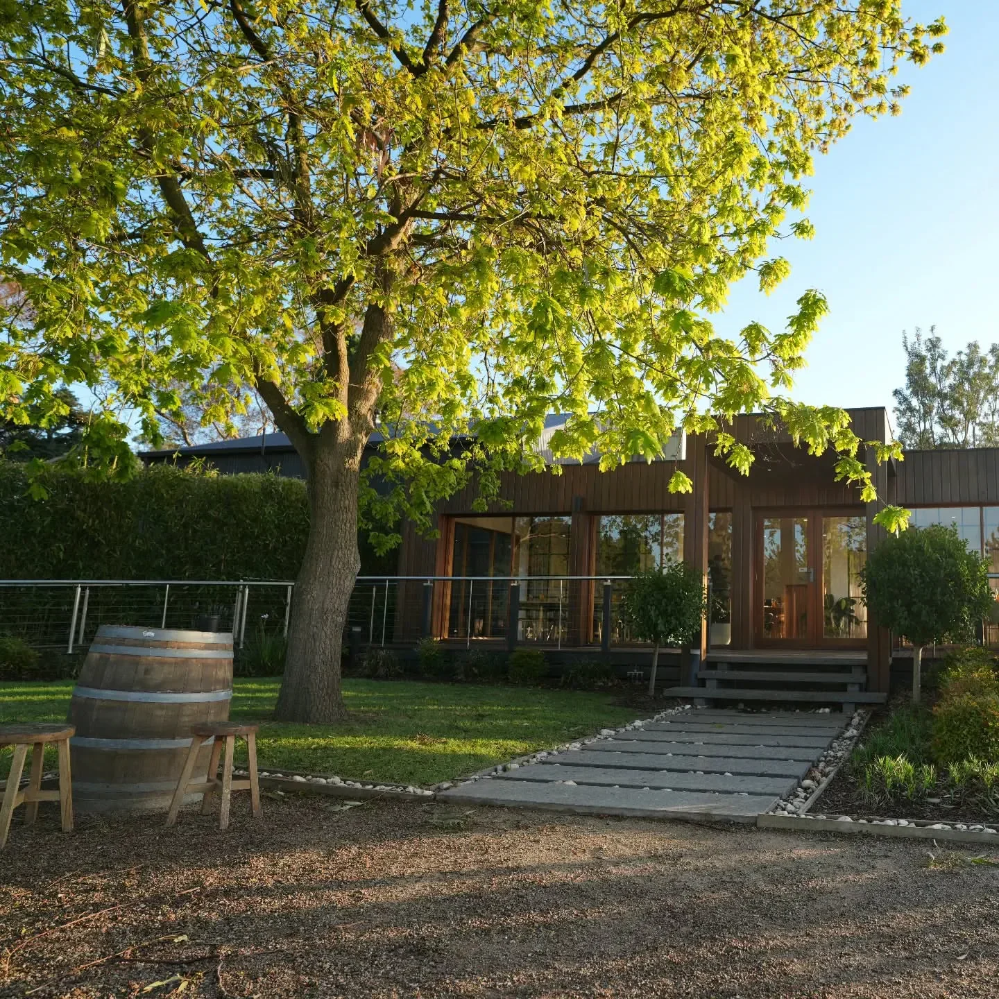 Exterior of Barmah Park Restaurant & Cellar Door in Mornington Peninsula, barrel and tree.