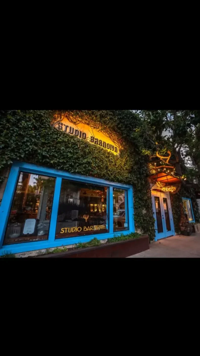 Exterior of Barndiva in Healdsburg, California, with ivy-covered facade and blue accents