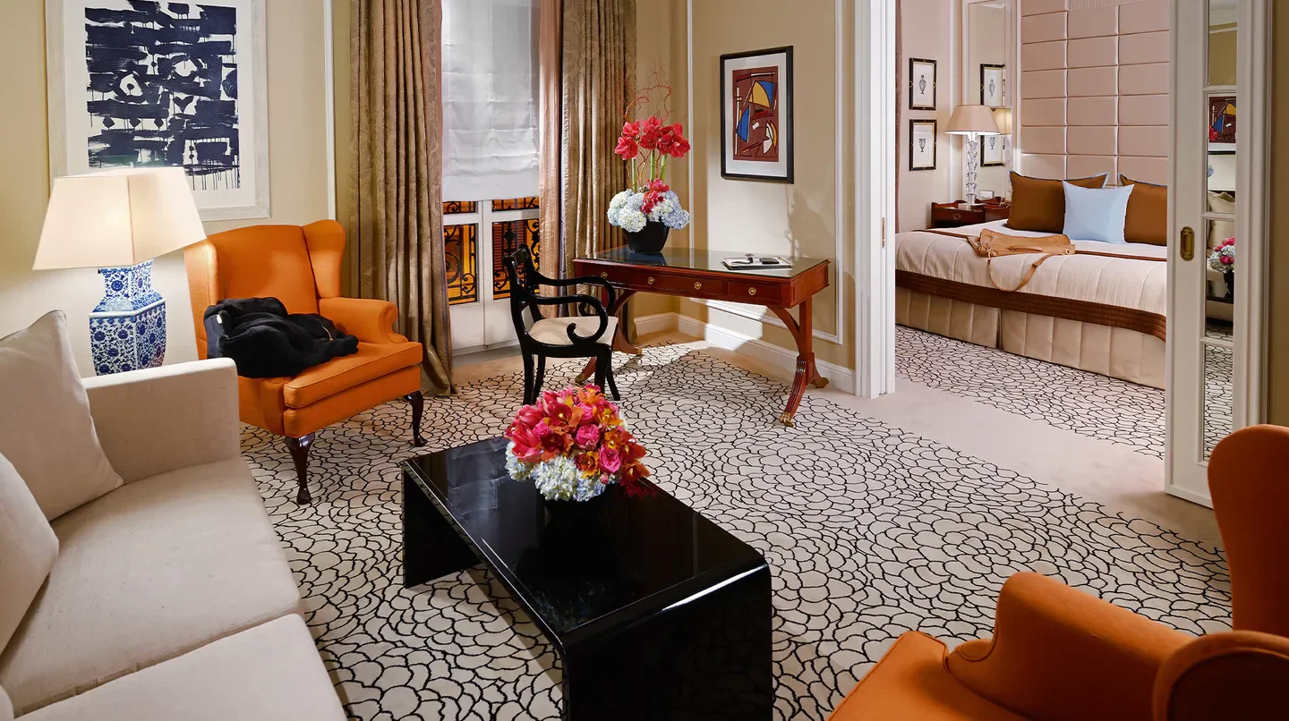 Elegant suite interior at Baur au Lac in Zurich, featuring stylish decor and a comfortable bedroom.