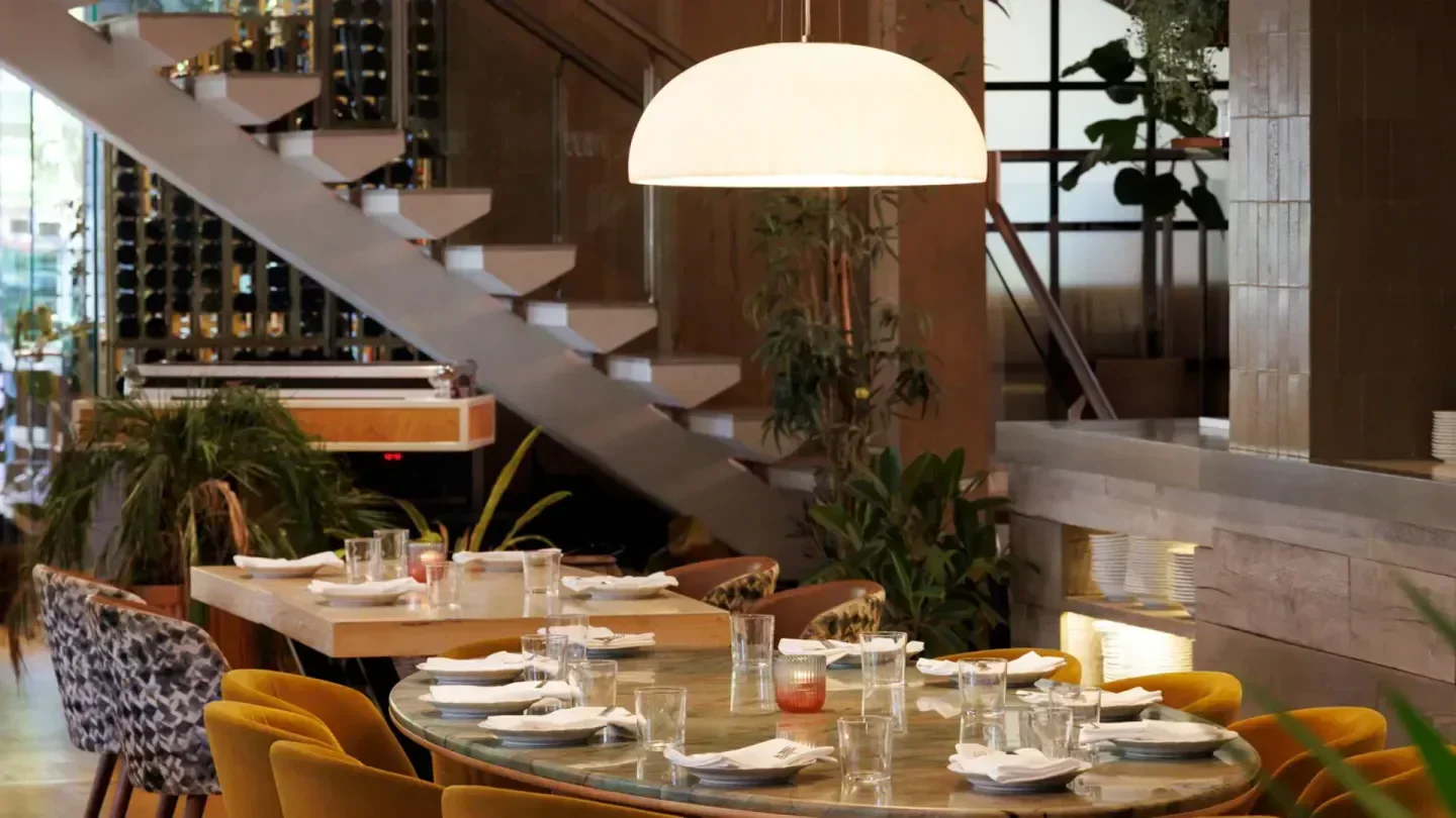Interior of Beach Club restaurant in Toronto, with stylish table settings and decor.