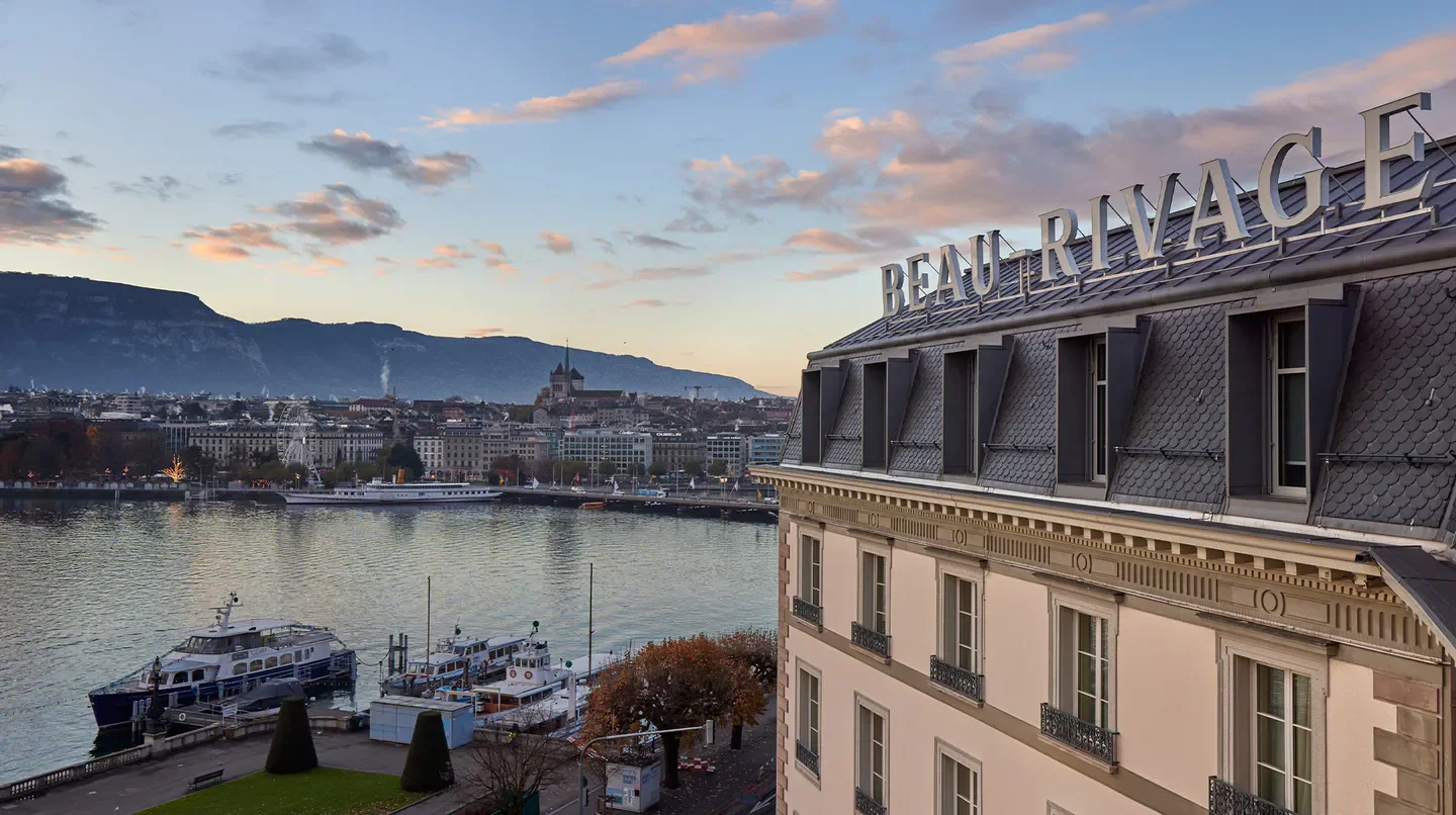 Beau-Rivage Genève hotel in Geneva, overlooking the city and lake at sunset