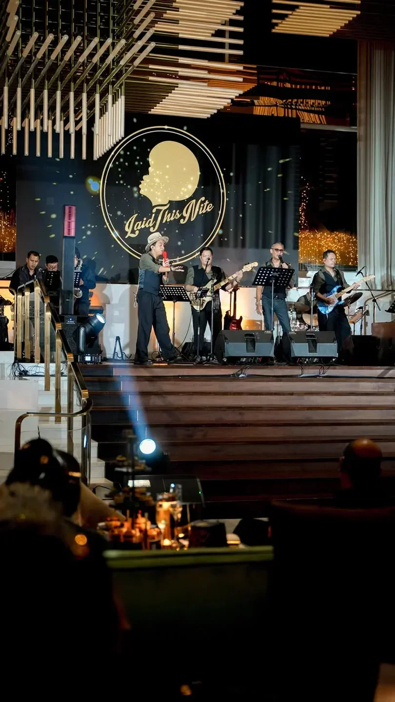 Live music at Bel Étage restaurant in Jakarta with a band performing on stage.