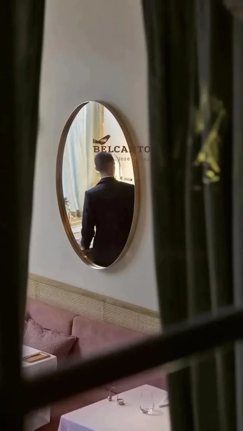 Mirror reflection in Belcanto Lisbon restaurant, stylish dining ambiance