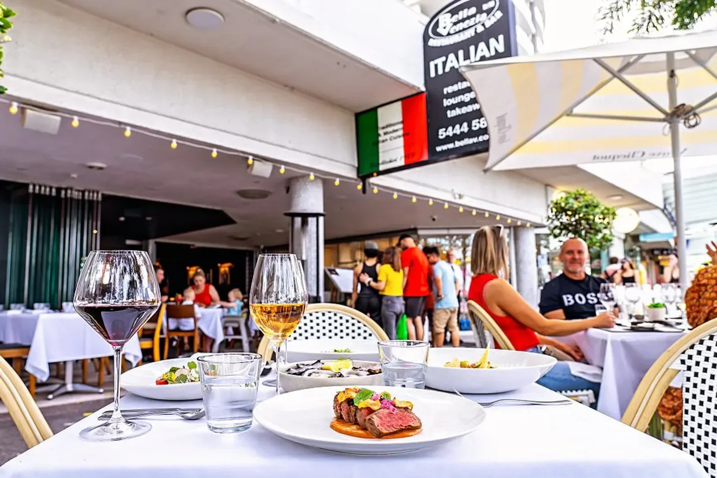 Outdoor dining at Bella Venezia restaurant, Sunshine Coast, featuring Italian dishes.