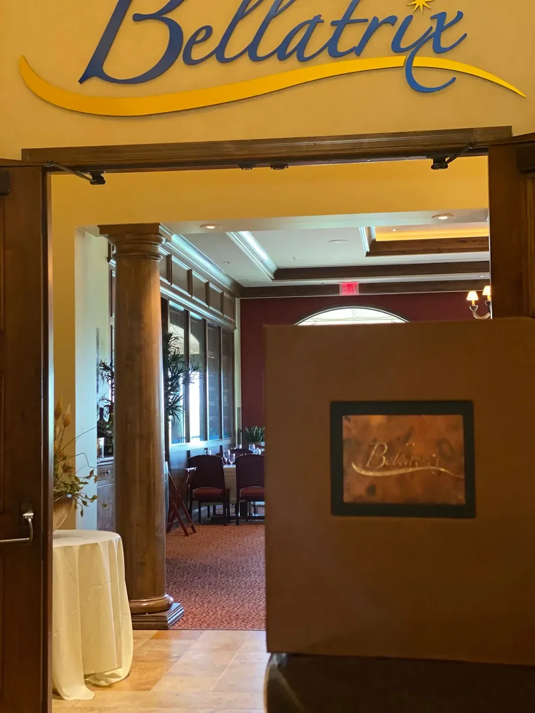 Entrance to Bellatrix restaurant in Palm Springs, elegant interior and inviting dining space.