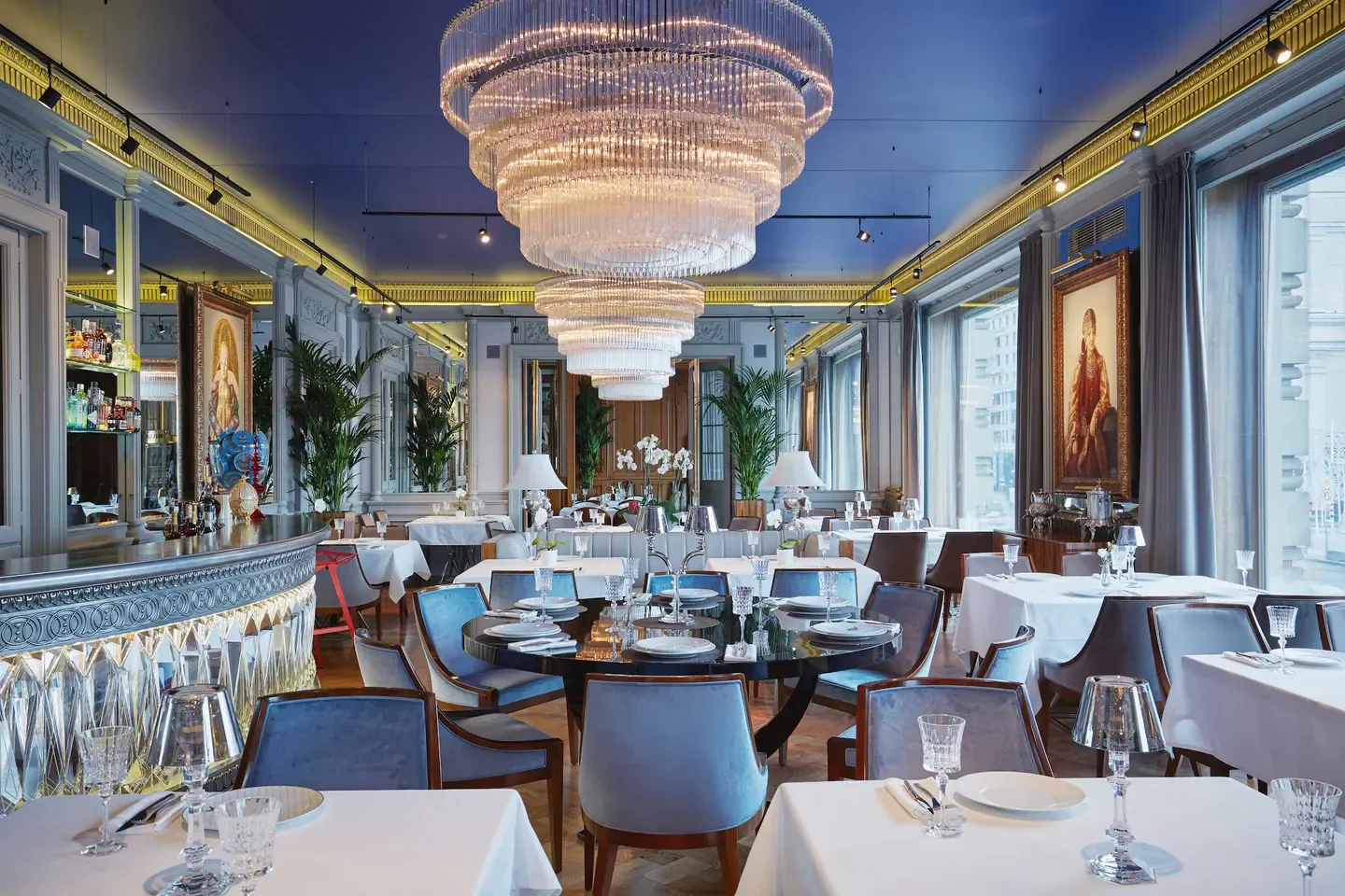 Elegant interior of Beluga restaurant in Moscow, featuring chandeliers and stylish seating.