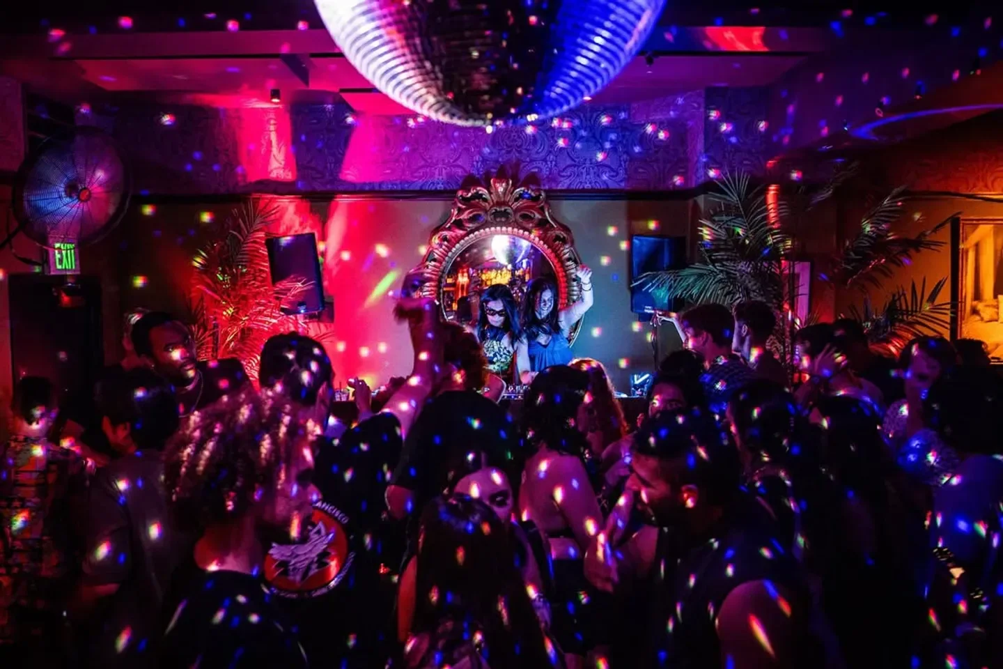 Disco ball and dancing crowd at Bergerac nightclub in San Francisco.