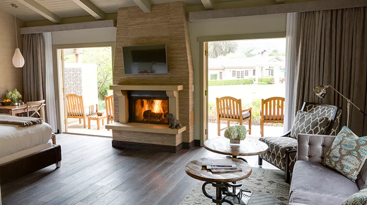 Cozy living space with fireplace at Bernardus Lodge & Spa in Monterey, California.