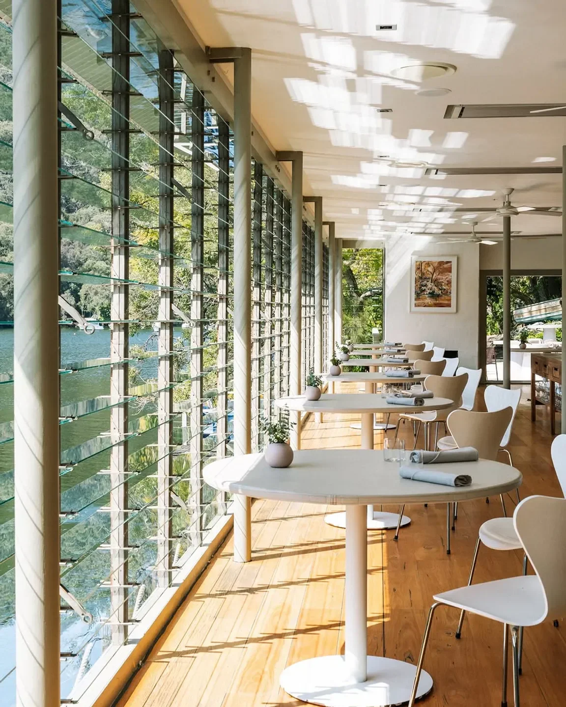 Dining room with water views at Berowra Waters Inn restaurant in Sydney.