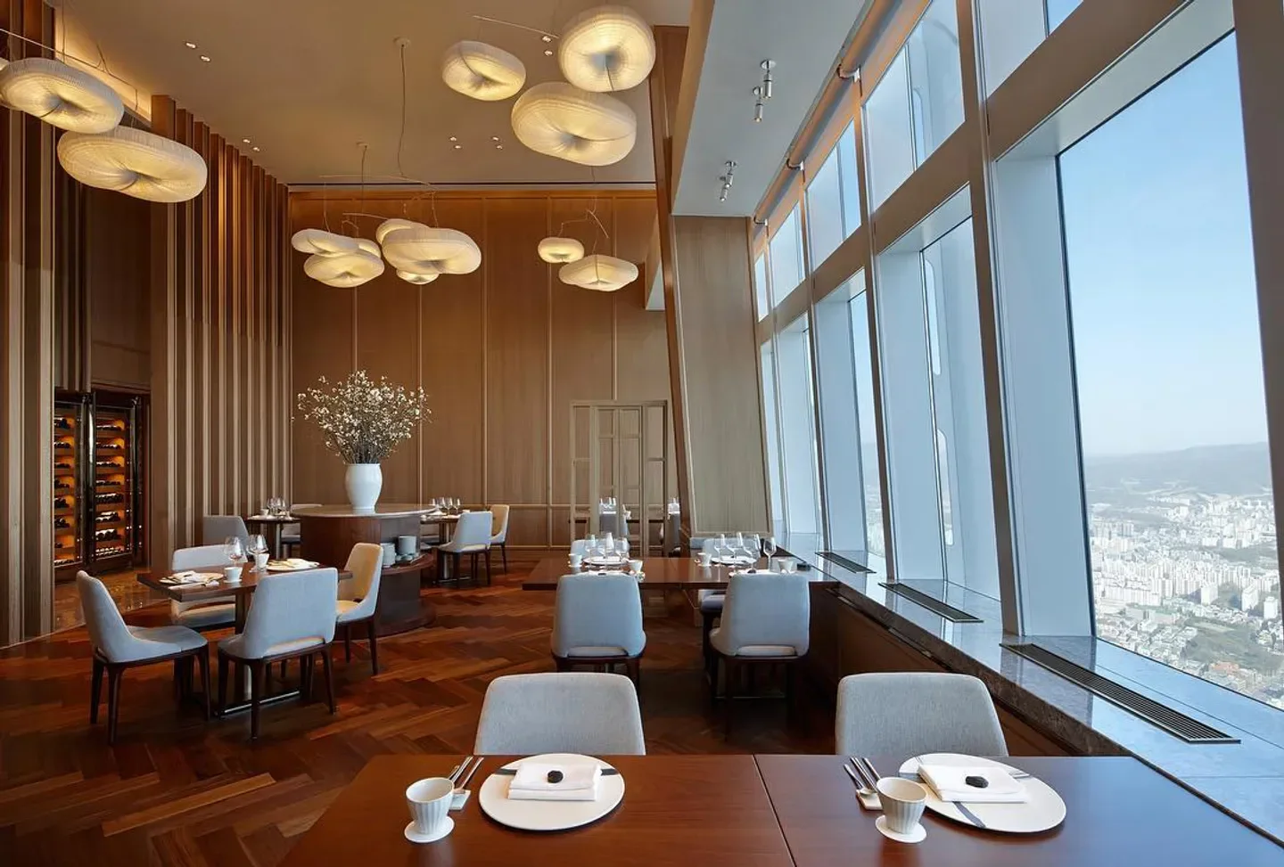 Bicena restaurant in Seoul with a view, featuring stylish interior and city skyline.