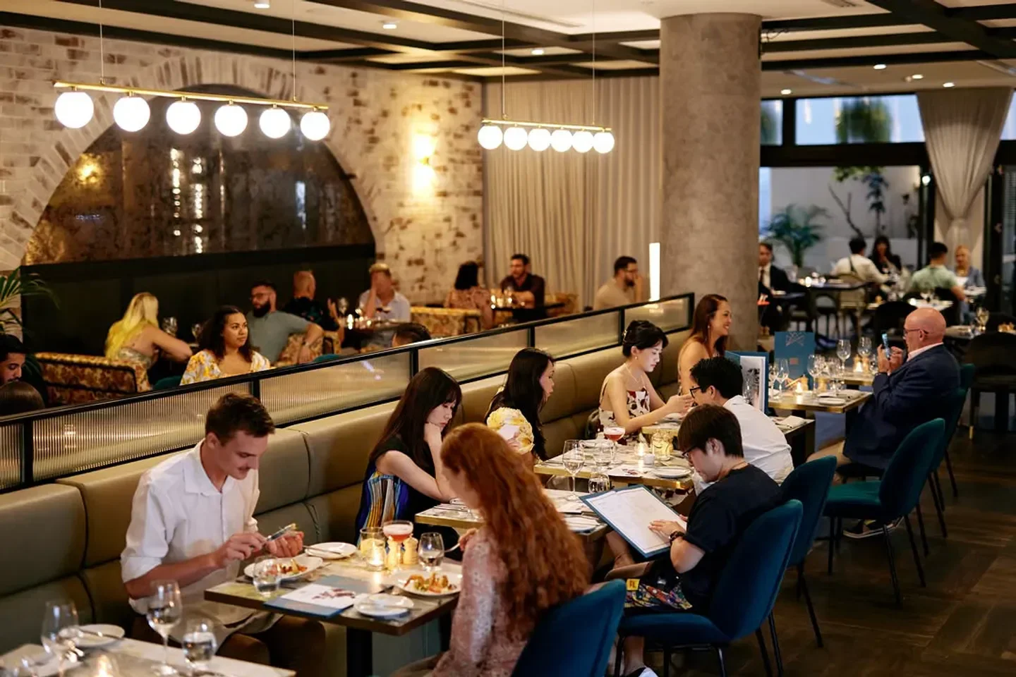 Bisou Bisou restaurant in Brisbane: Stylish interior with patrons dining and enjoying