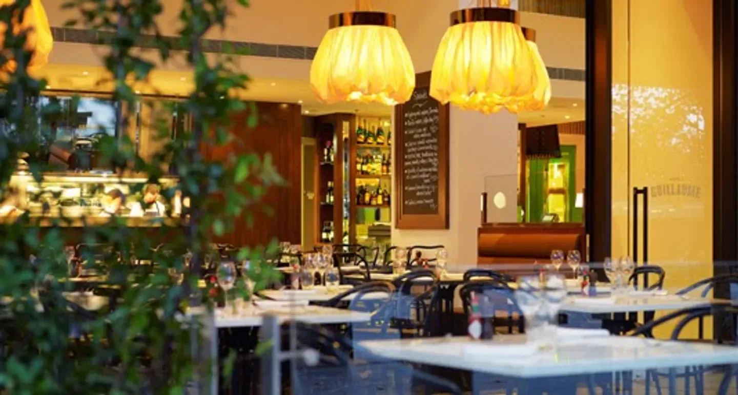 Interior of Bistro Guillaume in Melbourne, showcasing elegant dining area with stylish lighting.
