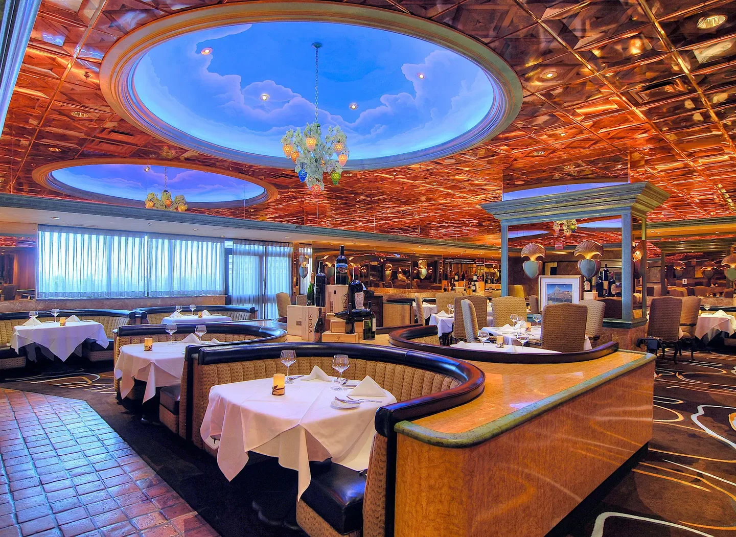 Interior of Bistro Napa in Reno, showing dining tables and unique ceiling art.
