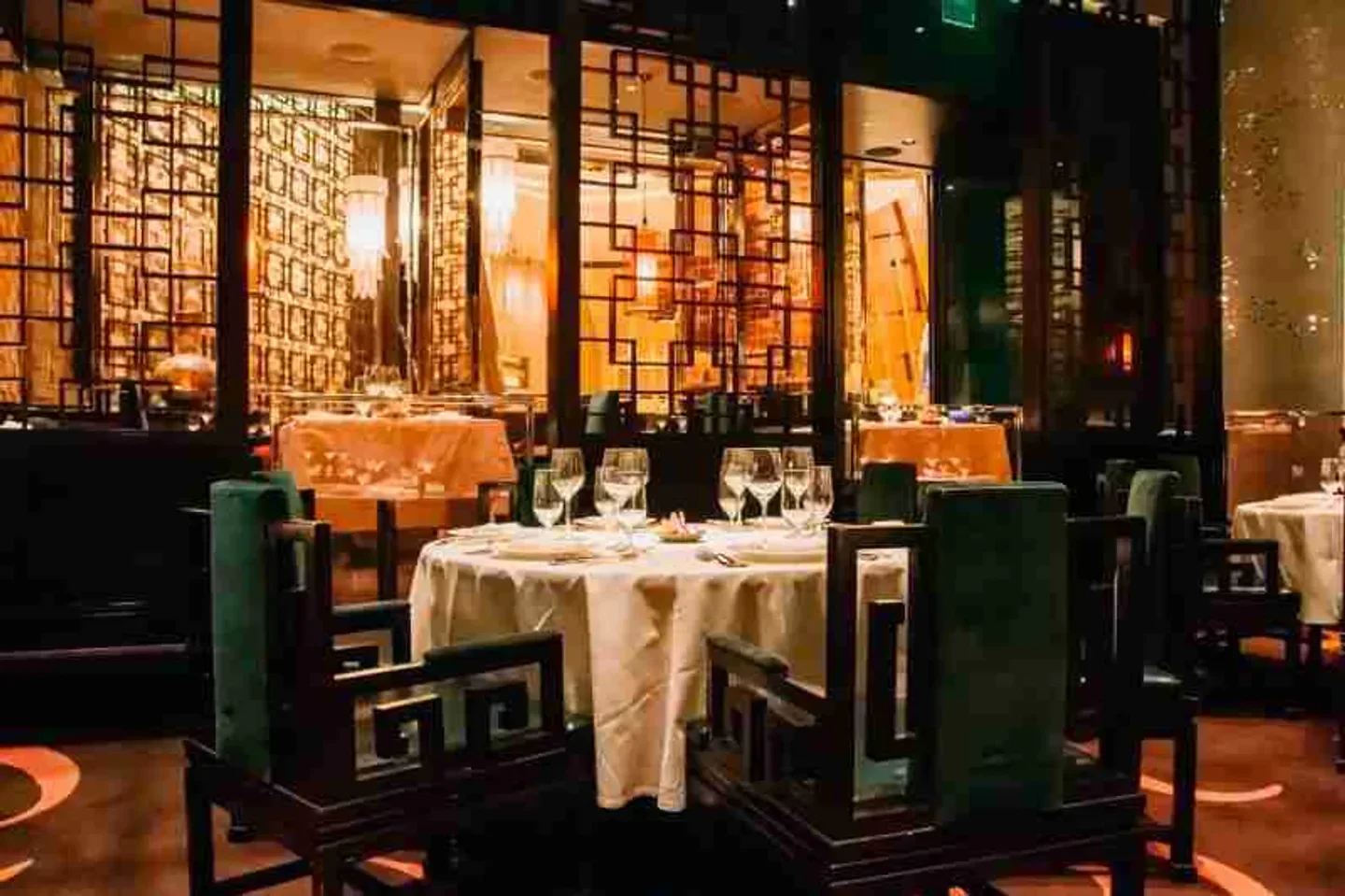 Elegant dining room at Blossom restaurant in Las Vegas, with tables set for service.