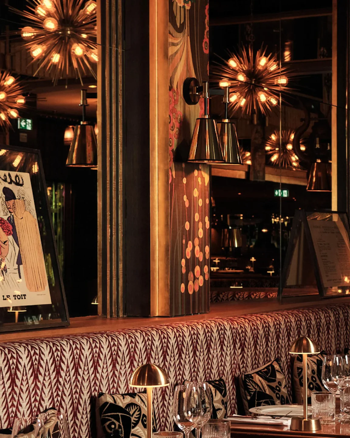 Interior of Boeuf sur le Toit restaurant in Paris, featuring stylish decor and warm lighting.