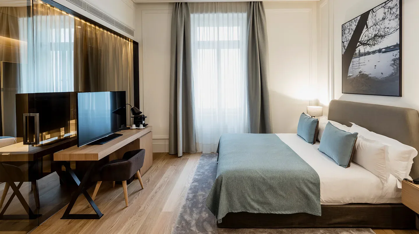 Cozy bedroom at BoHo Hotel Prague. Modern design in Prague hotel room.