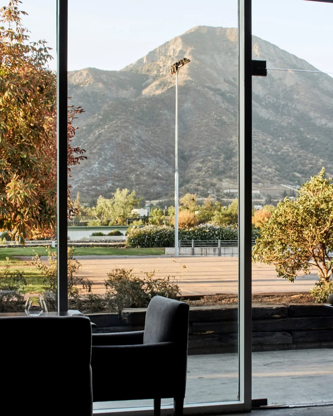 Scenic mountain view from Boragó restaurant in Santiago, Chile, showcasing the beautiful landscape through large windows.
