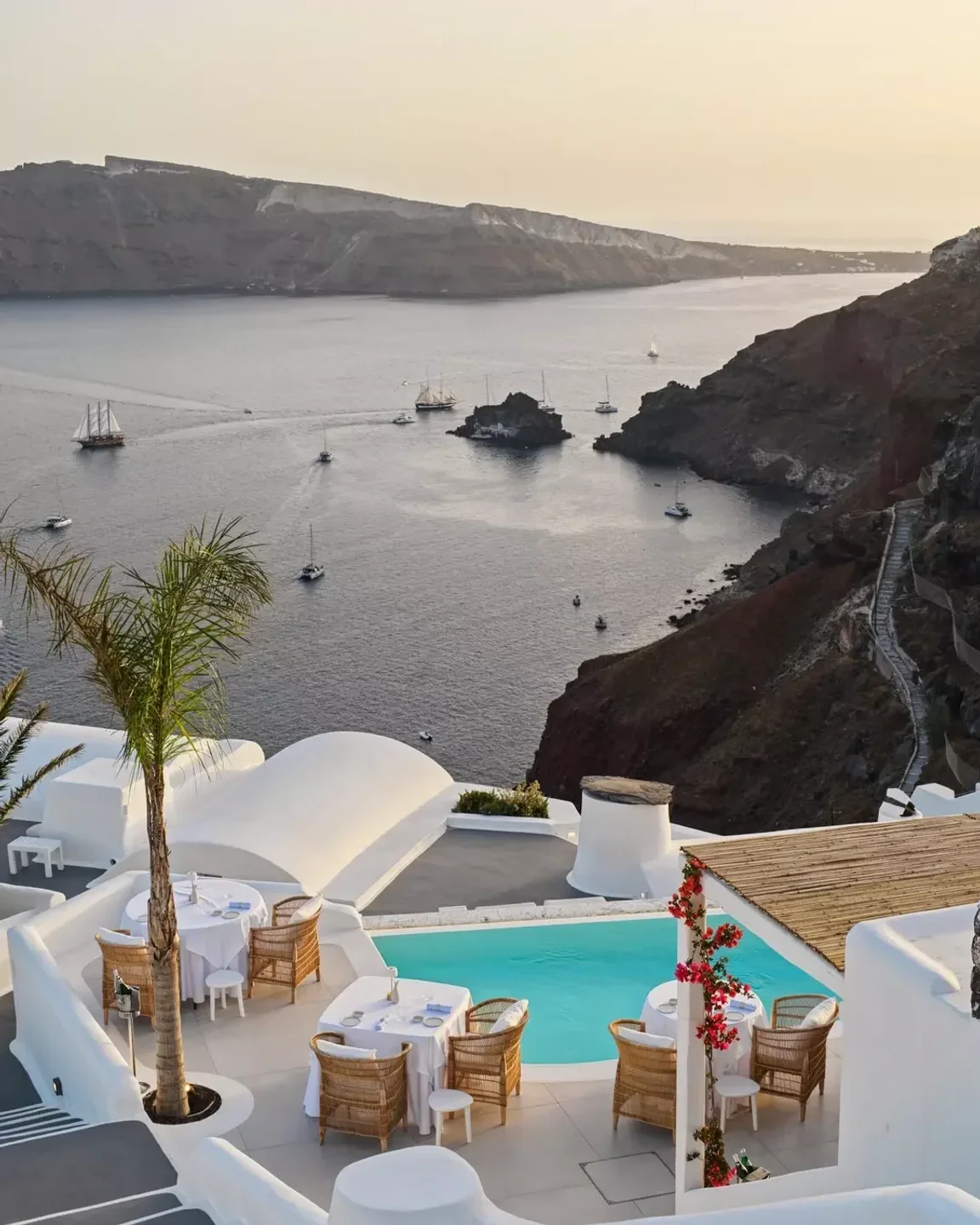 Botrini's restaurant in Santorini offers stunning caldera views from its poolside terrace dining area.