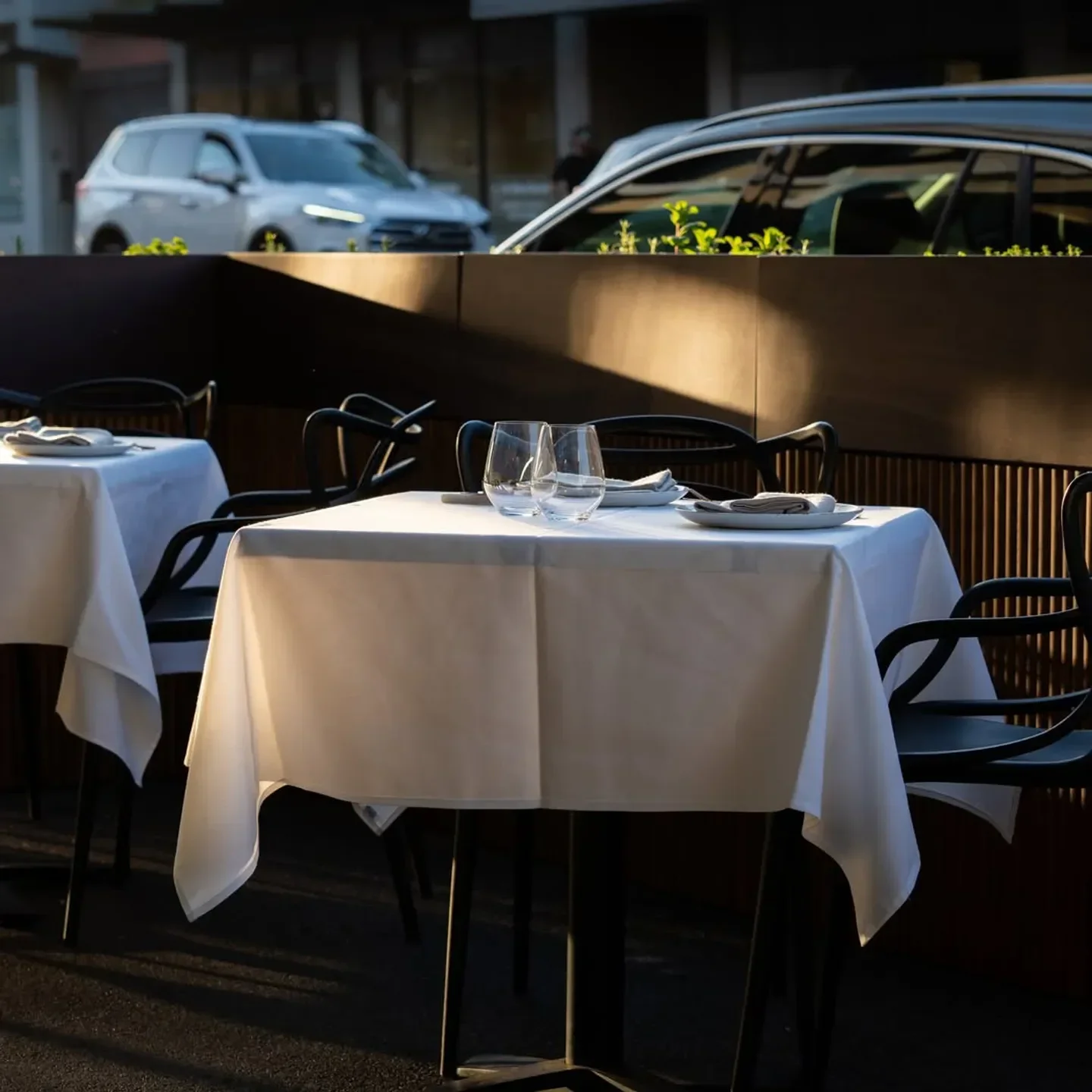 Outdoor dining at Bottarga in Melbourne, with elegant tables and chairs set for dinner