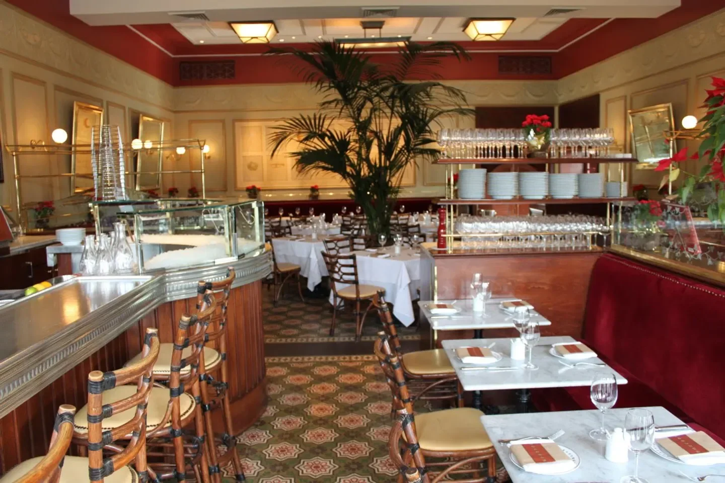 Interior dining at Bouchon Yountville, Napa Valley, with marble tables and elegant decor