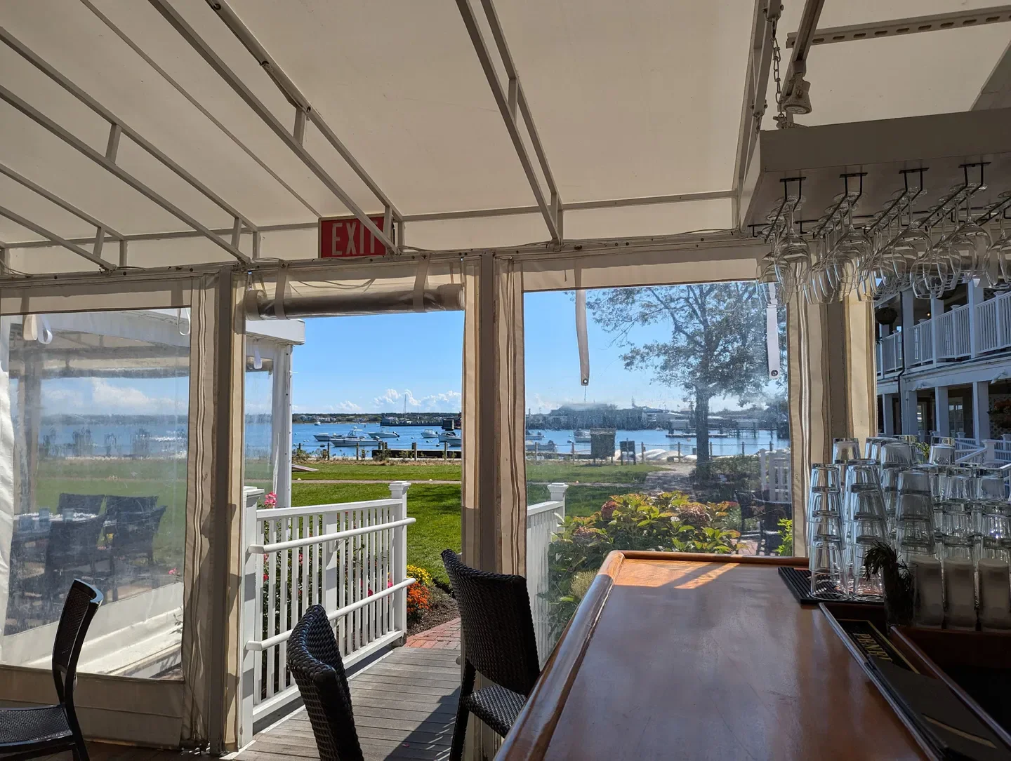 Outdoor view from Brant Point Grill in Nantucket with water and boats in the background