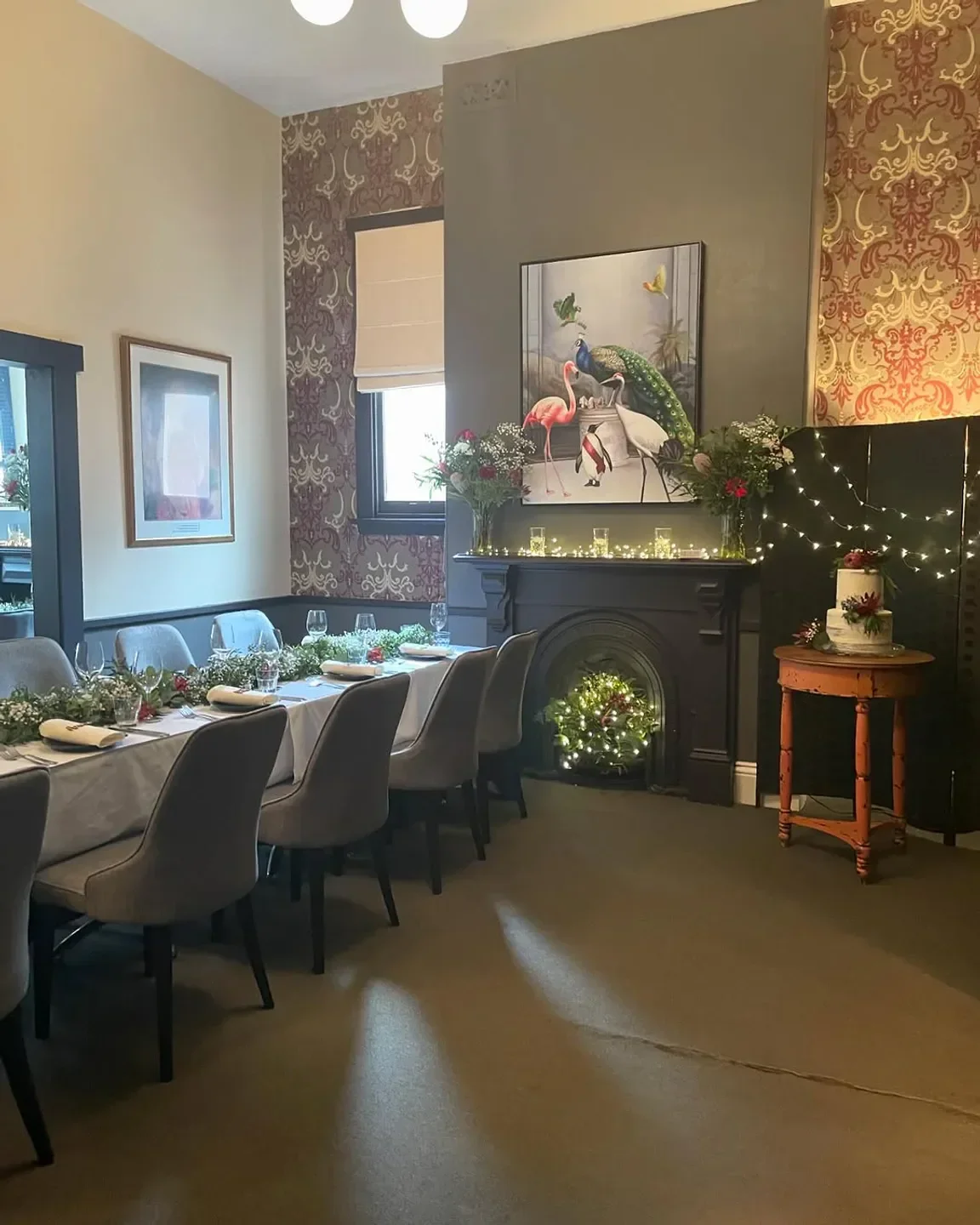Elegant dining area at Brisbane Street Bistro in Launceston, featuring artwork and decorated table.