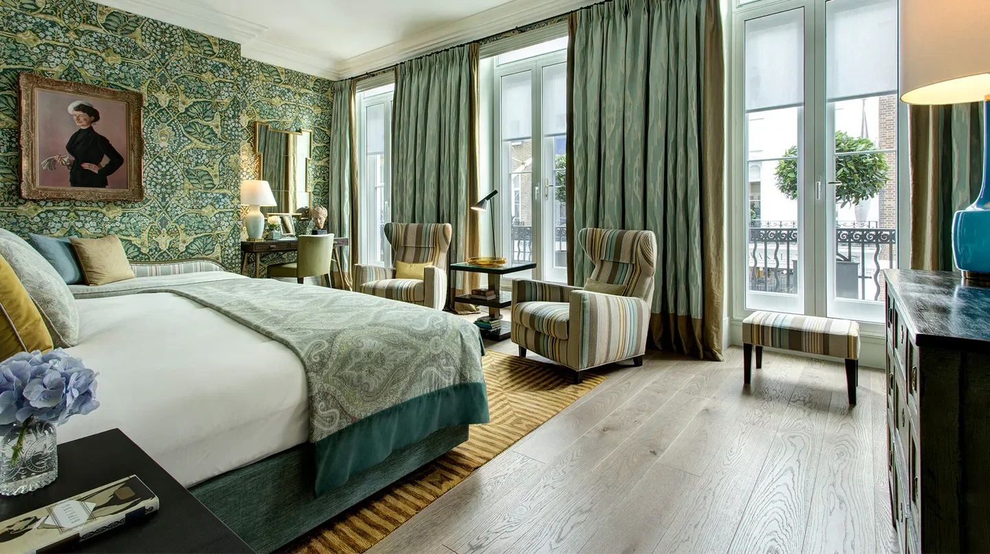 Elegant bedroom at Brown's Hotel, a Rocco Forte Hotel in London, with stylish decor.