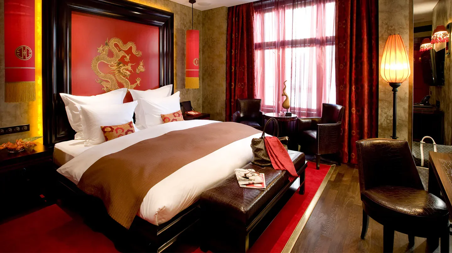 Stylish hotel room at Buddha-Bar Hotel Prague, featuring luxury bedding in Prague