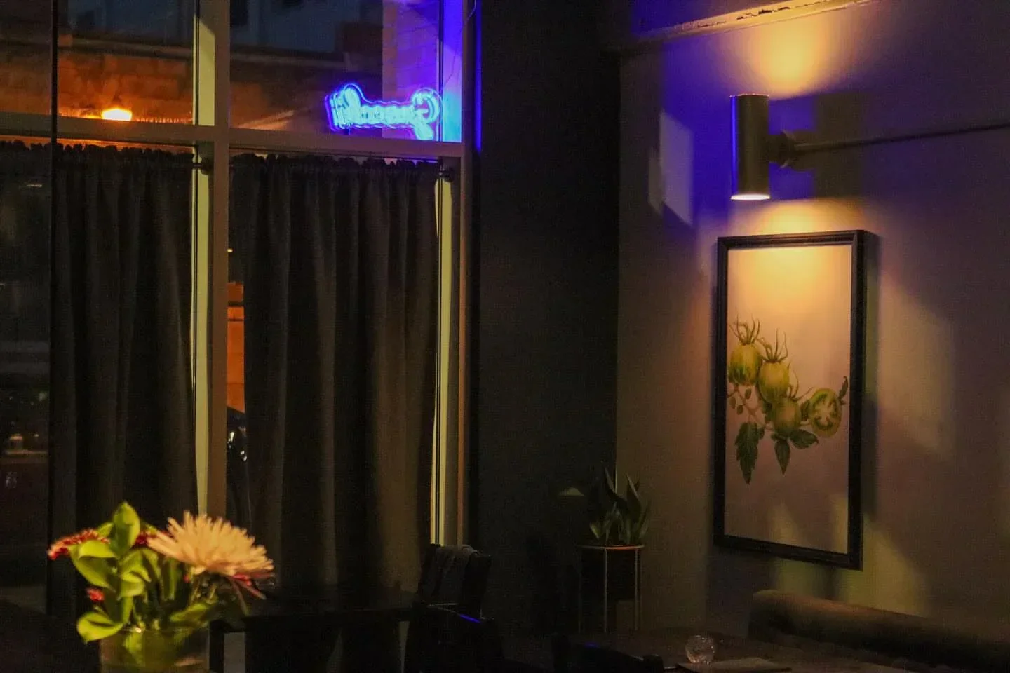Interior shot of Bündok restaurant in Edmonton, with art and ambient lighting.