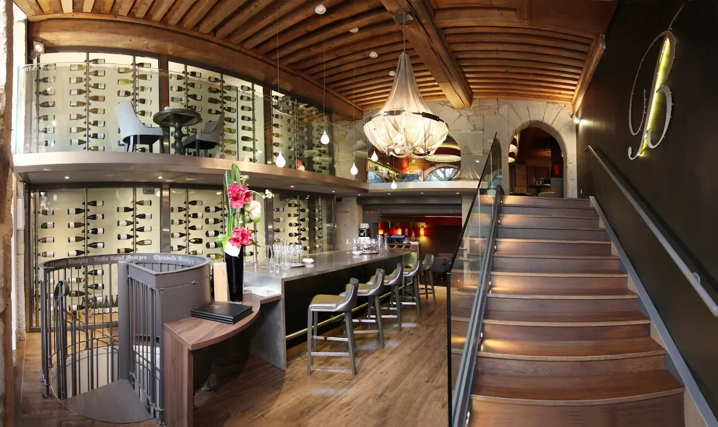 Interior of Burgundy by Matthieu restaurant in Lyon with wine cellar and bar.