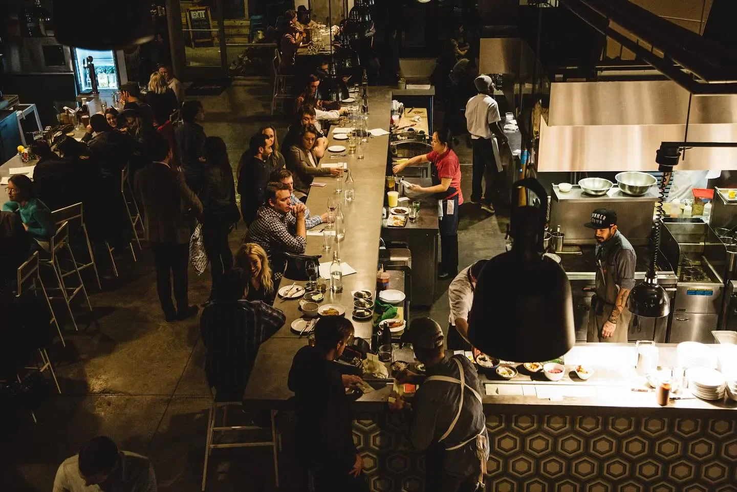 Busy open kitchen and bar at Butcher & Bee in Charleston, South Carolina