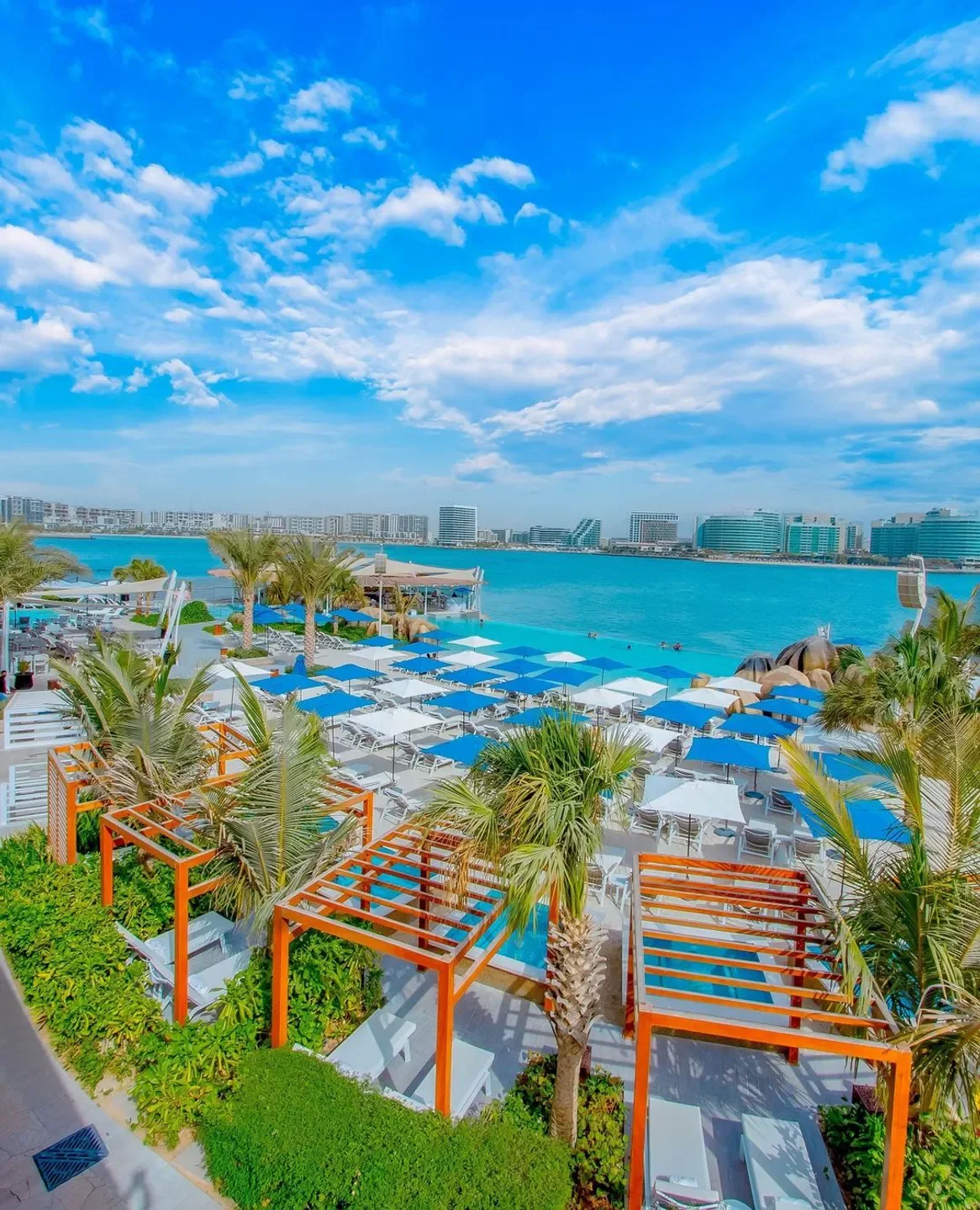 Café del Mar Abu Dhabi beach club with pool, umbrellas, and ocean views in Abu Dhabi