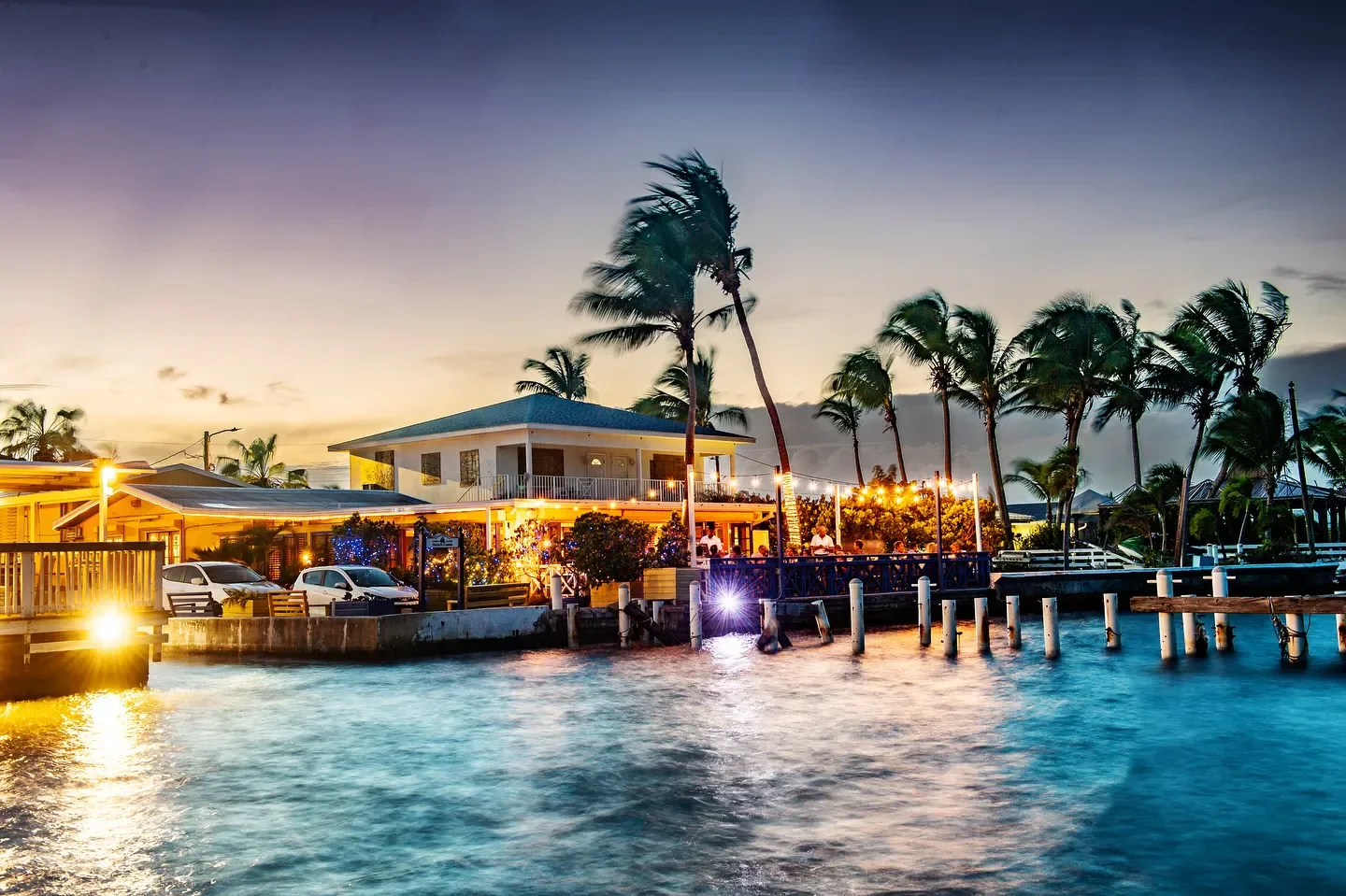 Waterfront view of Calypso Grill restaurant in Grand Cayman at sunset