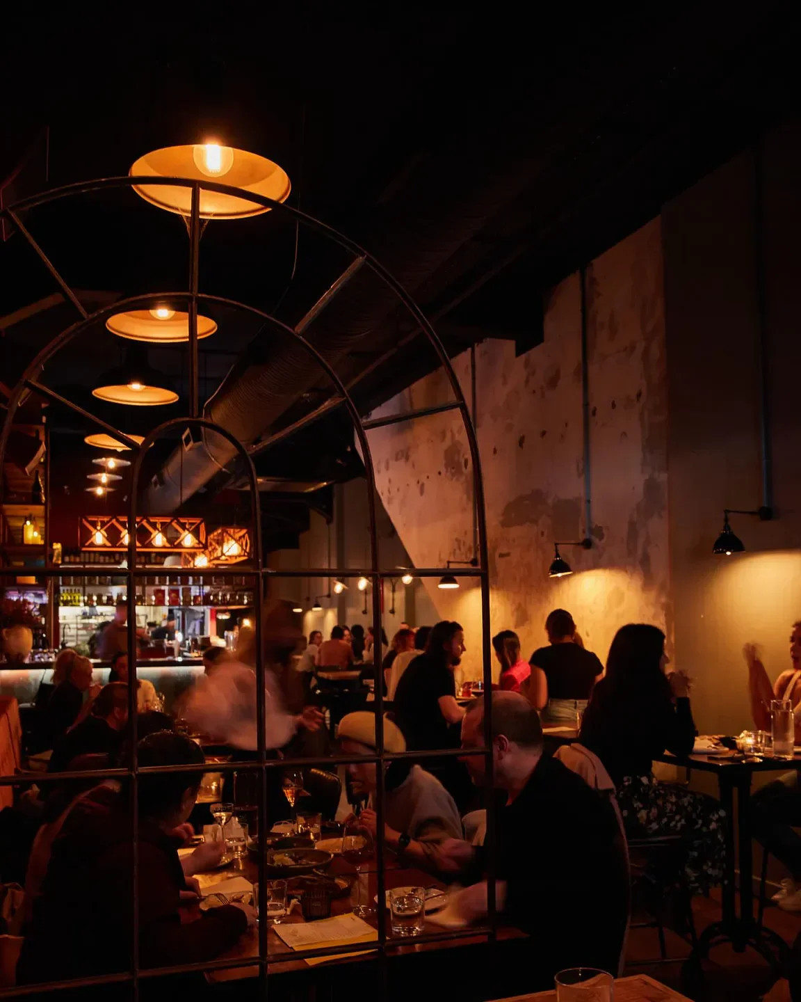Candela restaurant in Auckland, with warm lighting and diners enjoying the ambiance.