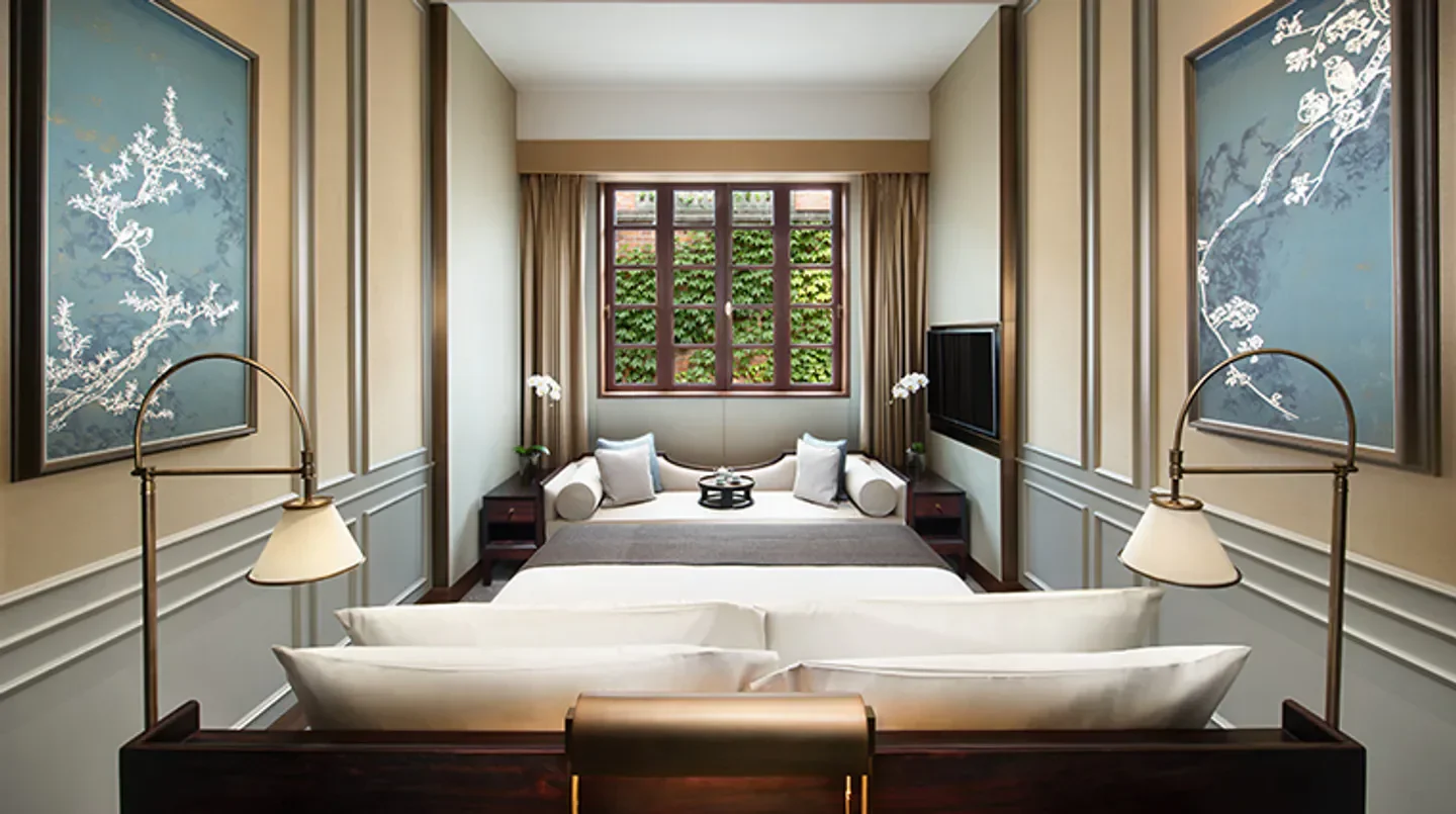 Cozy bedroom at Capella Shanghai, Jian Ye Li, with a relaxing ambiance in Shanghai.