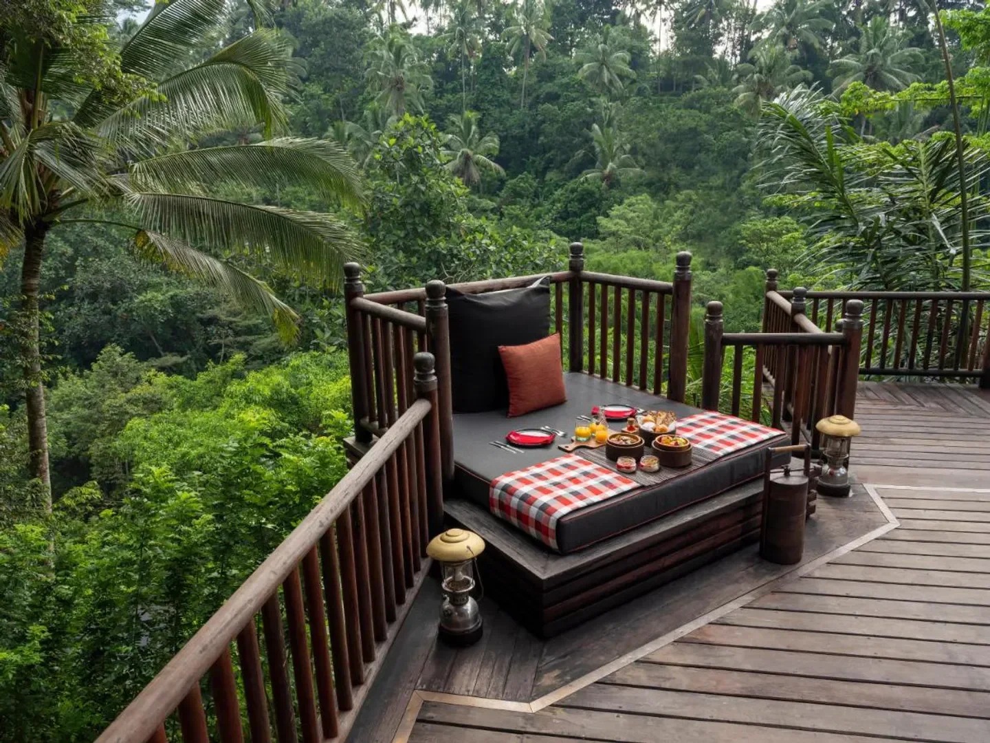 Breakfast setting at Capella Ubud, Bali, overlooking lush tropical forest in Bali.