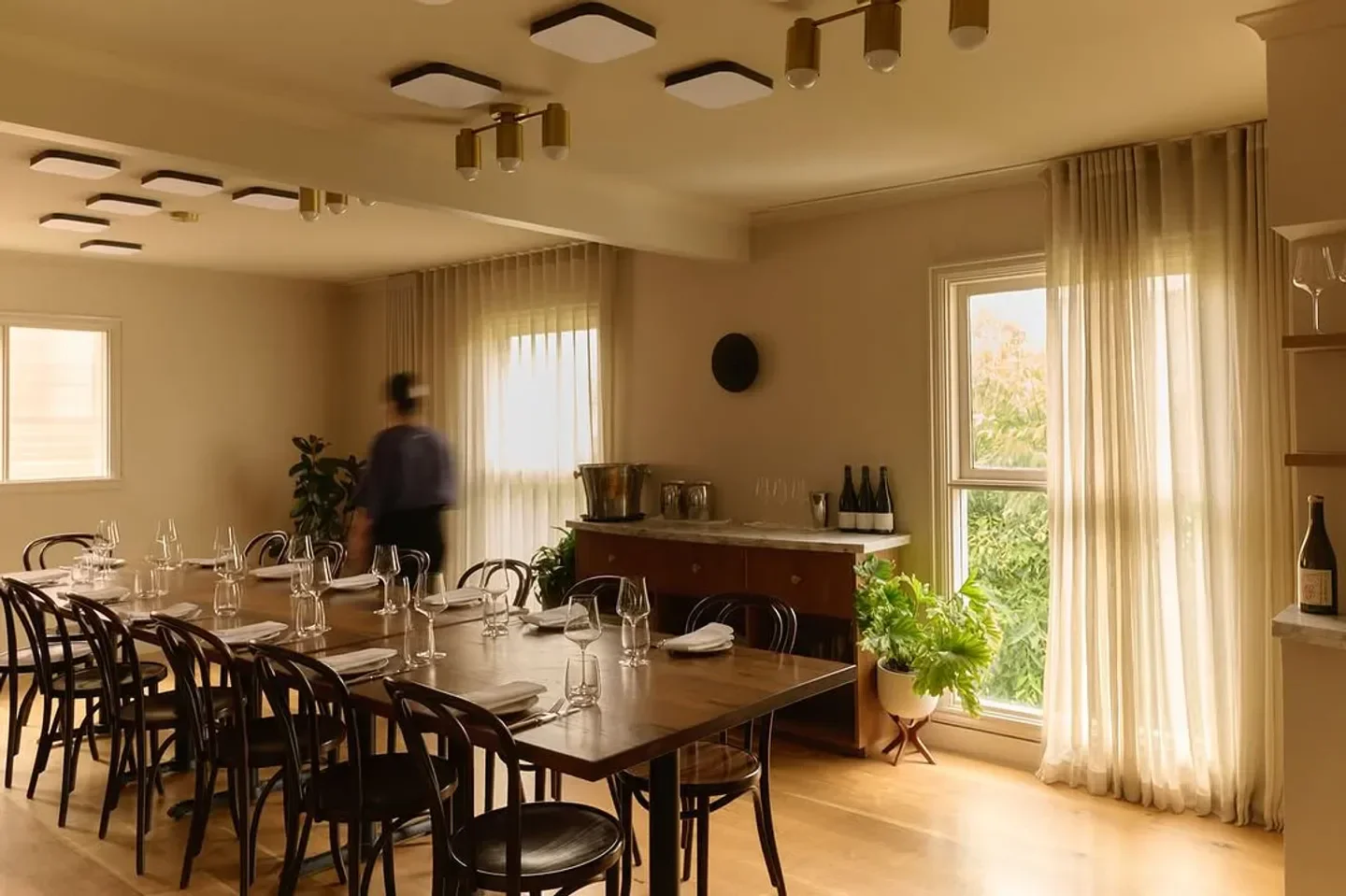 Interior of Carlton Wine Room in Melbourne, Australia, featuring elegant dining table and decor.