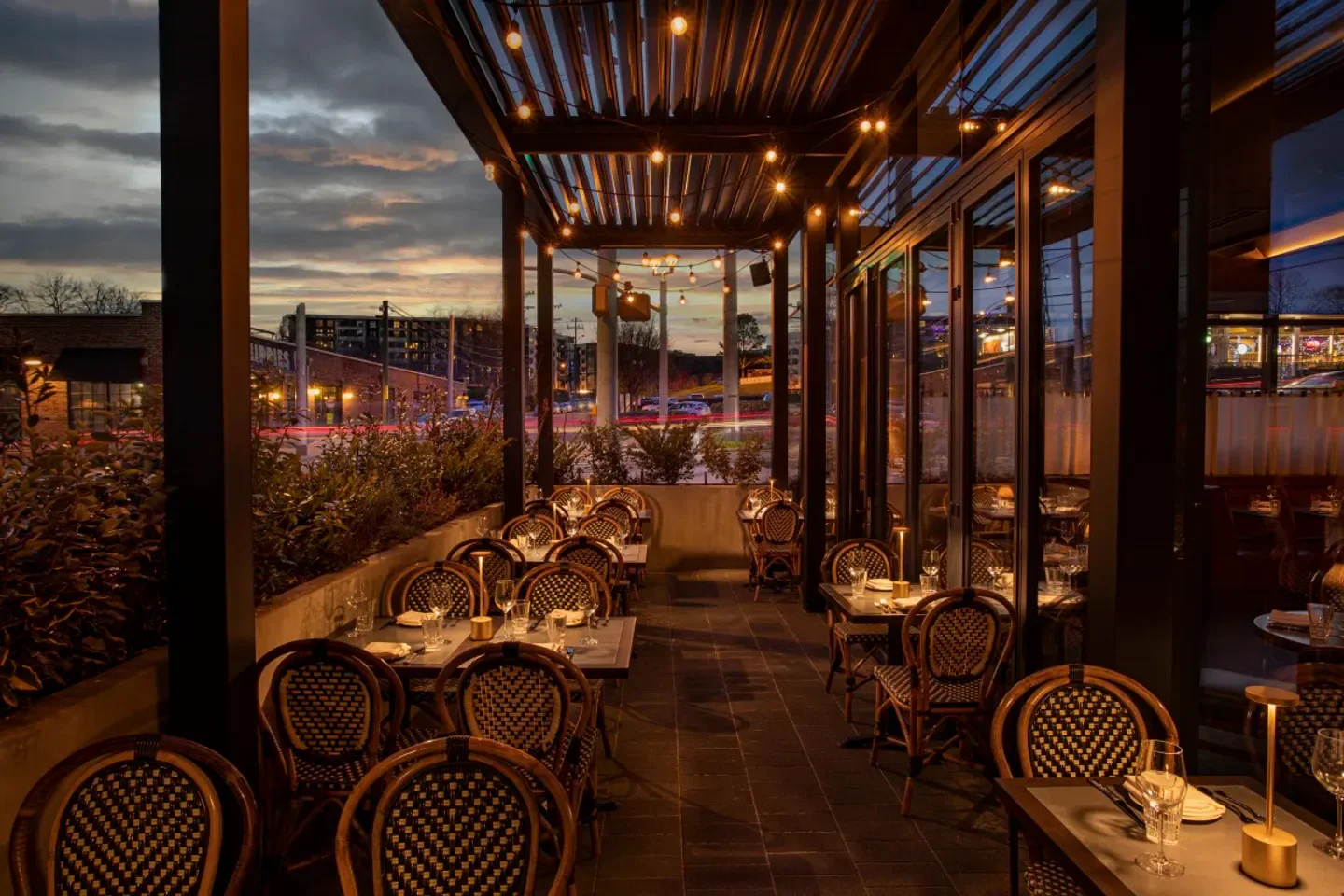 Outdoor dining at Carne Mare - Nashville. Dusk setting in Nashville, with warm lighting.