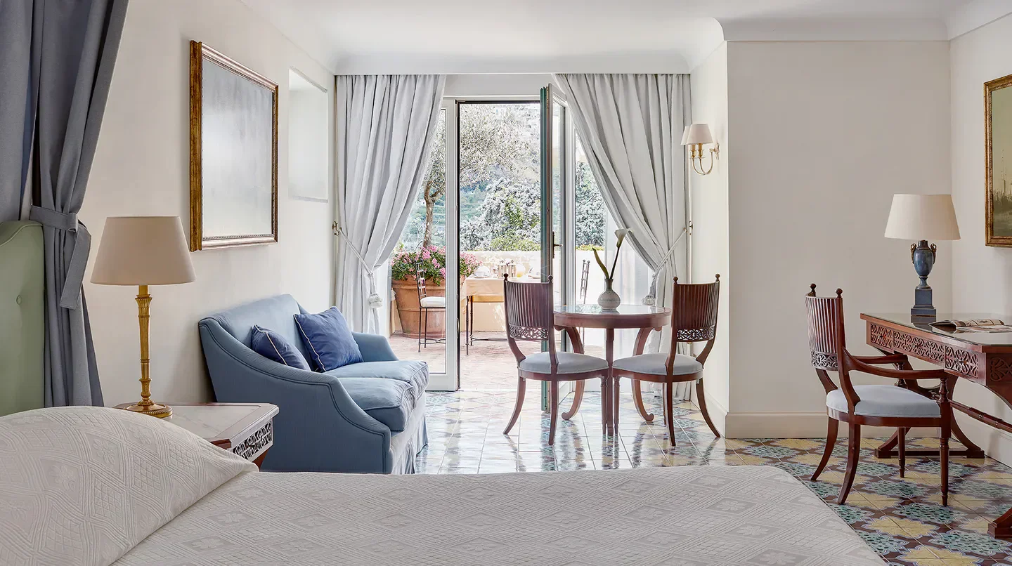 Elegant room at Caruso, A Belmond Hotel, Amalfi Coast, with terrace overlooking Rome.
