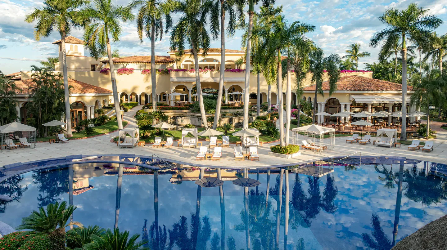 Casa Velas hotel in Puerto Vallarta with a stunning pool and palm trees
