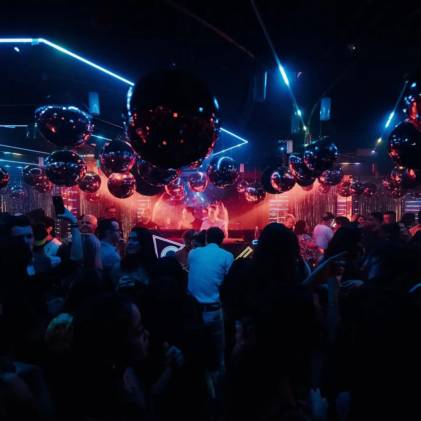 Disco balls and lively crowd inside Cassio nightclub in Hong Kong