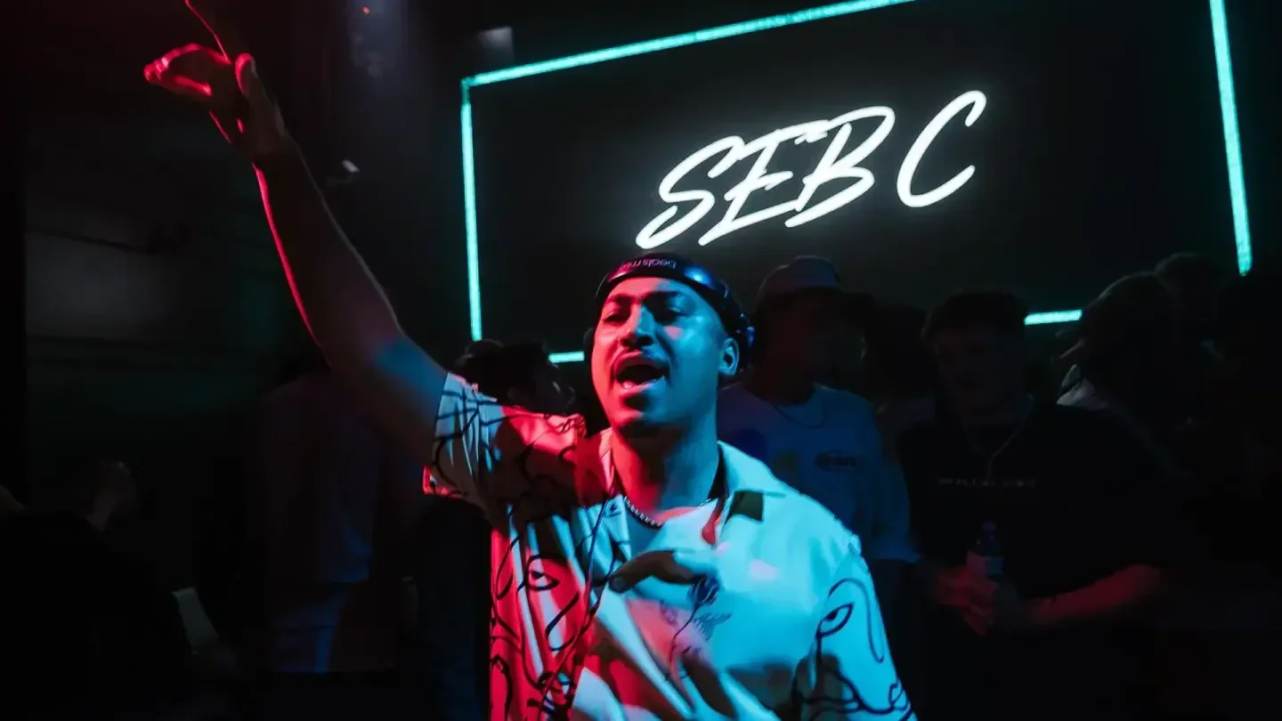 Energetic performer at Celebrities Nightclub in Vancouver, under club lights