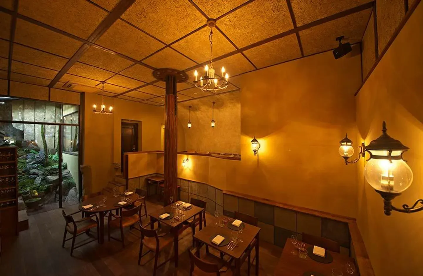 Cozy interior of cenci restaurant in Kyoto, with elegant lighting and wooden tables.