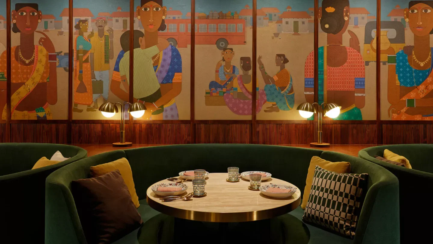 Cozy dining area at CHAAT in Hong Kong, featuring beautiful Indian-inspired murals.