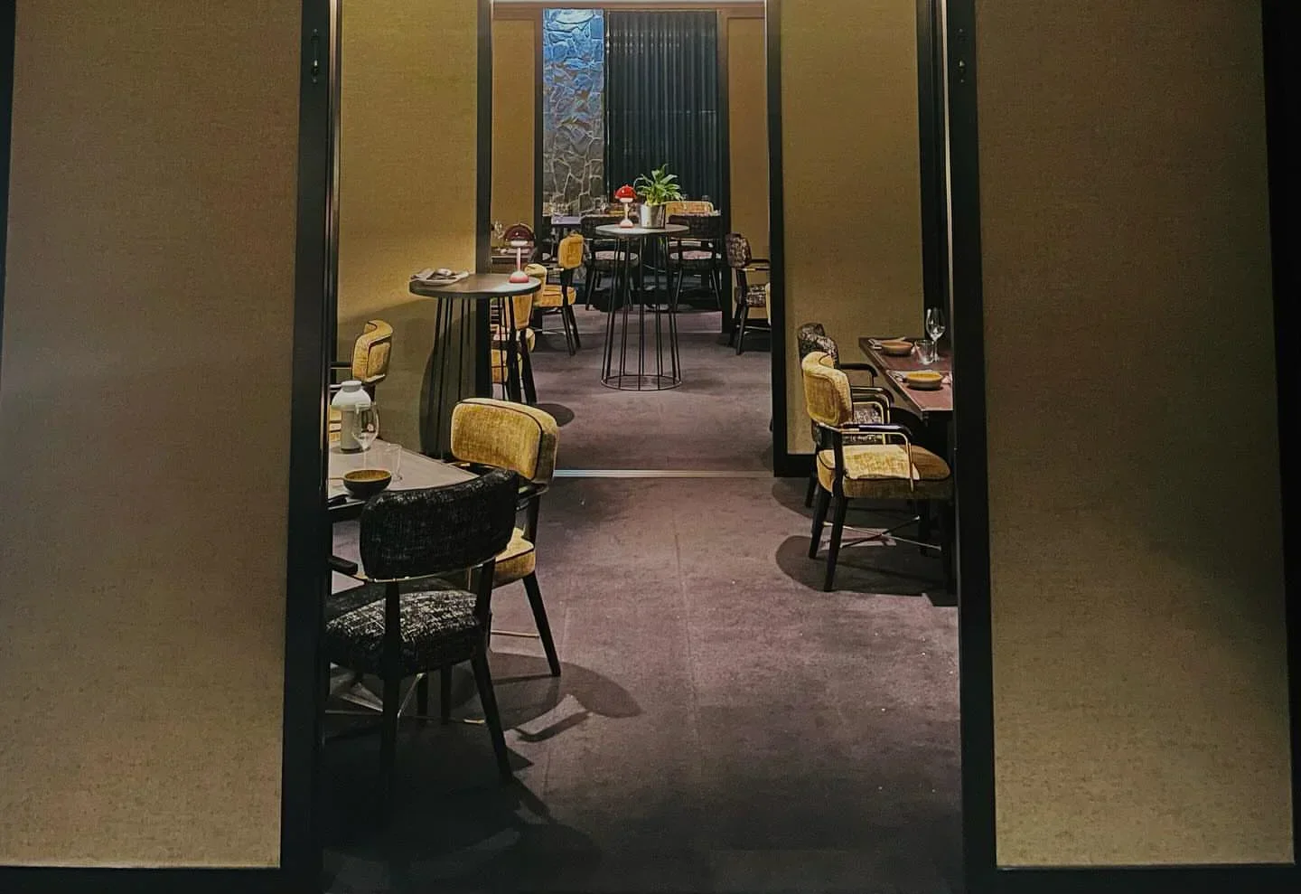 Interior view of Chairman and Yip restaurant in Canberra, featuring stylish seating and decor.