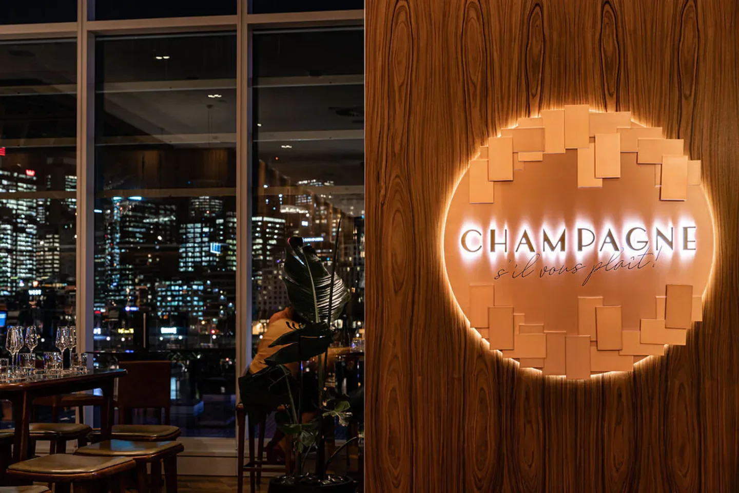 Champagne Bar in Sydney with a stylish interior and city views at night.